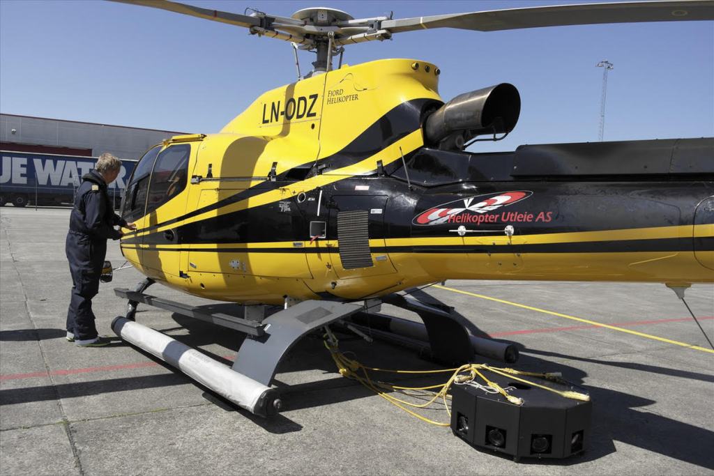 Arild Solberg uses a helicopter to carry the Hasselblad rig, which he can control remotely.