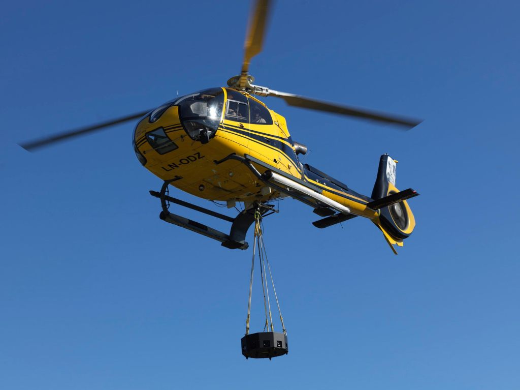 360aircam's custom-built Hasselblad medium format rig being carried by a helicopter