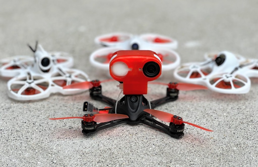 EMAX Nanohawk X (front) with Tinyhawk 2 (left), EZ Pilot (rear), and Tinyhawk 1 (right)